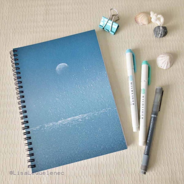 Spiral bound A5 (6x8) notebook with a moon sparkling over the ocean on the cover