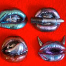 Handmade epoxy resin fridge magnet 'lips'.