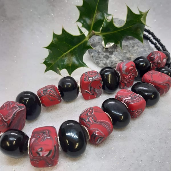 Large statement necklace in red, black and silver