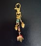 Gold autumnal beaded bag charm with leaf, acorn and pine cone charms  - Image 2
