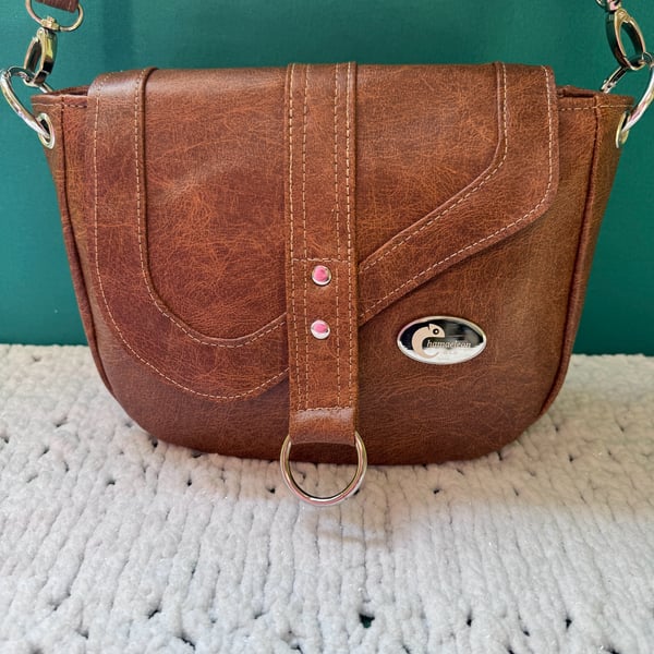 Brown crossbody saddle bag in soft faux leather