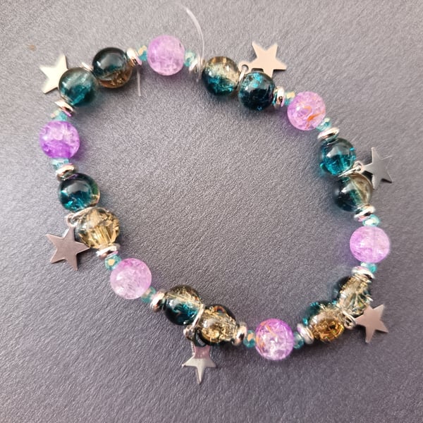 Elasticated blue and purple beaded bracelet with star charms 