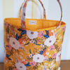 Reusable fabric gift bag; floral design on yellow
