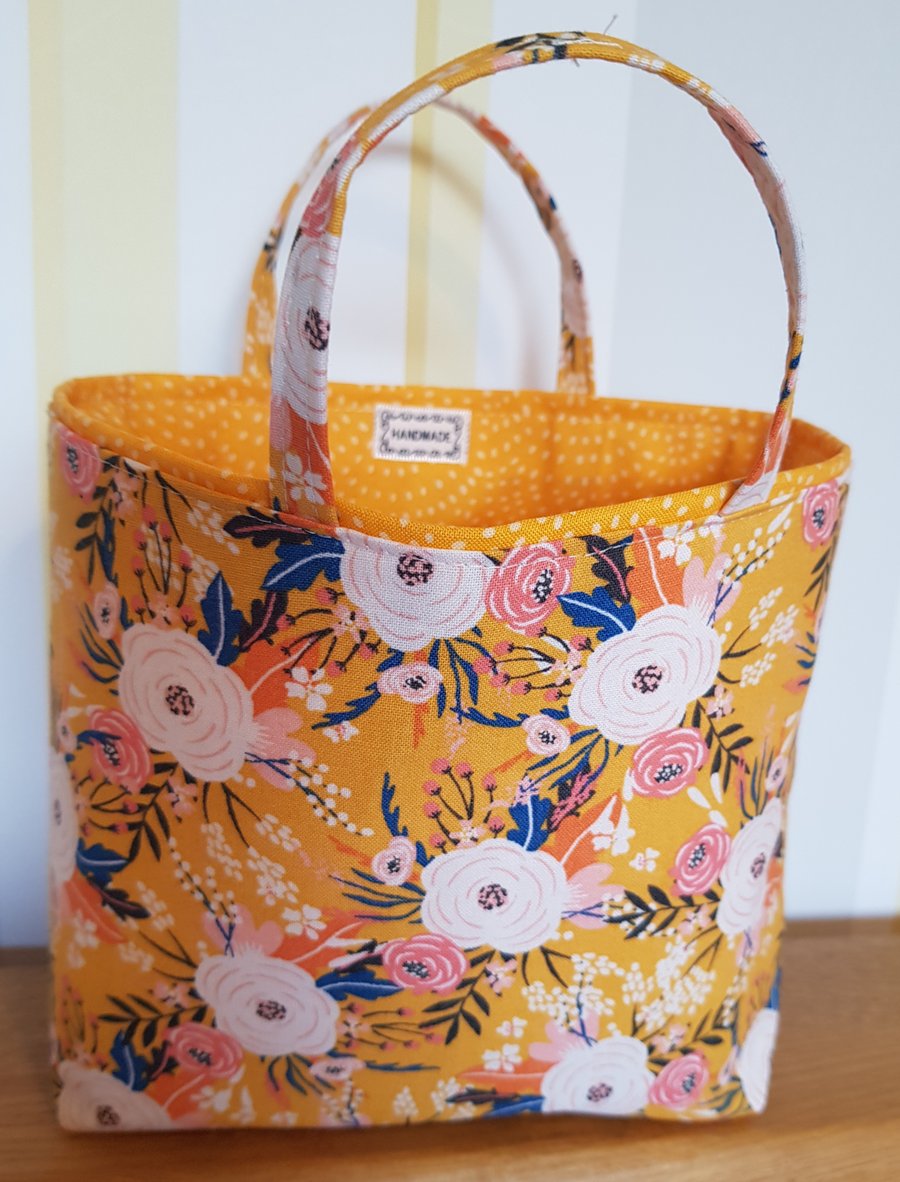 Reusable fabric gift bag; floral design on yellow