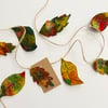 Felted embroidered autumn leaf garland or bunting home decorations. 