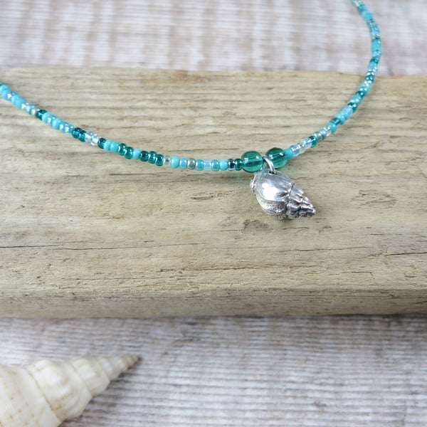 Seed Bead Necklace with a Silver Coated Little Bear Conch Shell - Turquoise