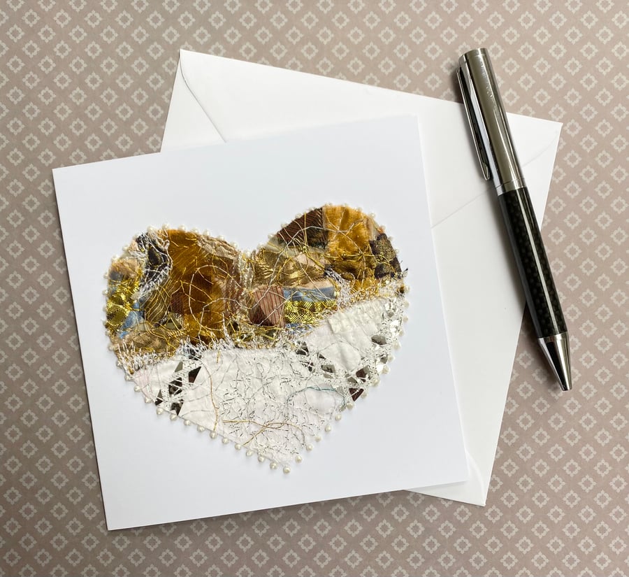 Up-cycled handmade fabric embroidered heart card. 