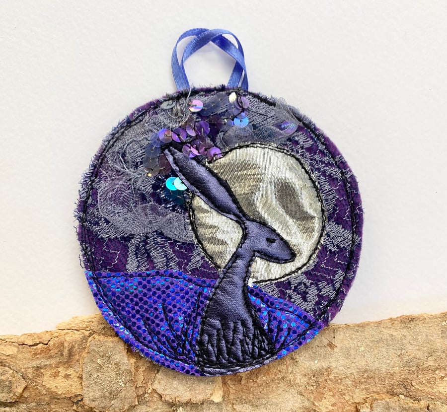 Upcycled embroidered moonlight hare home decoration. 