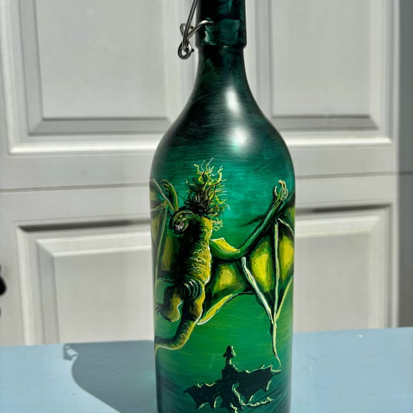 Dragons in a bottle hand painted and fired by Andrew Jenkins 