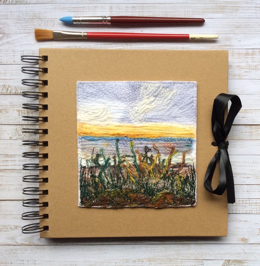 Sunset seascape embroidered sketchbook, journal or scrapbook. 