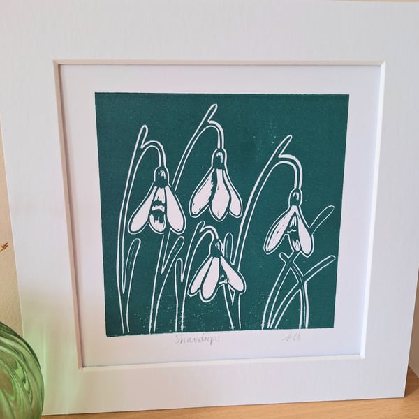 An original handprinted linoprint of snowdrops.