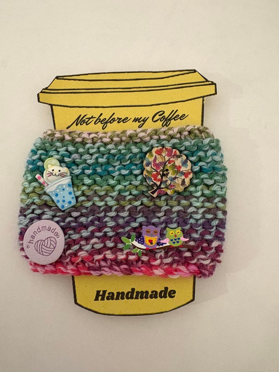 Cat in a cup with owl embellishments knitted cup cosy. 