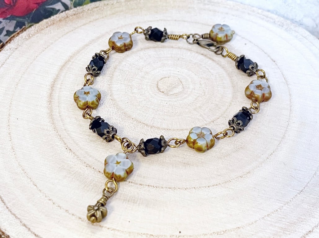 Pale blue and black bohemian flower bracelet