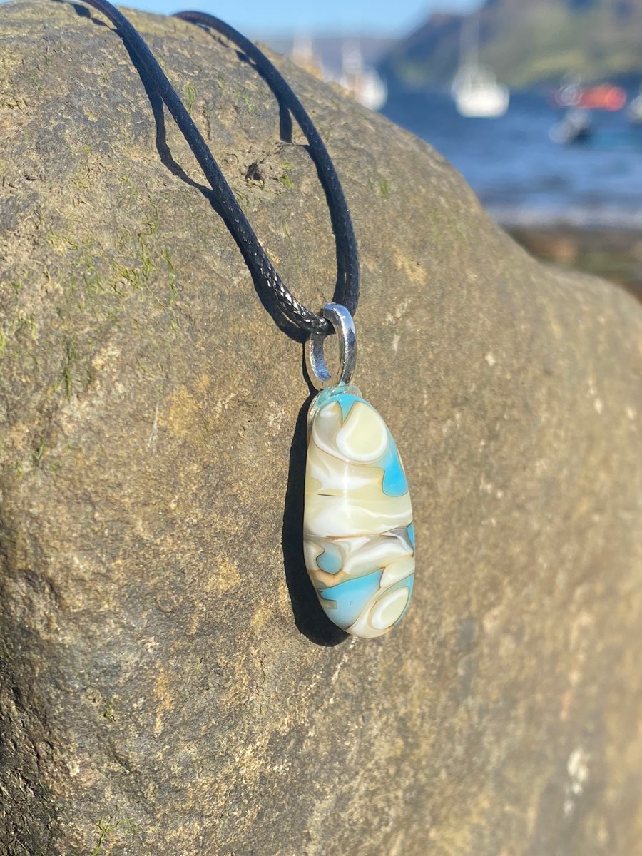 Cream and pale blue swirl puddle fused glass pendant