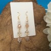 Ultra glamorous peach glass dangle earrings