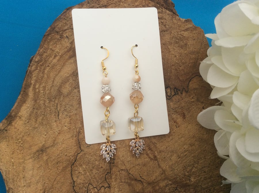 Ultra glamorous peach glass dangle earrings