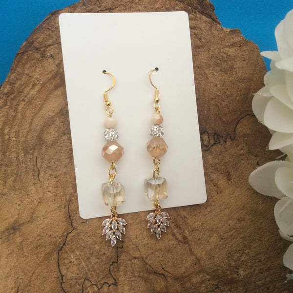 Ultra glamorous peach glass dangle earrings
