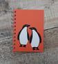 Orange Penguins A6 Notebook - Image 1