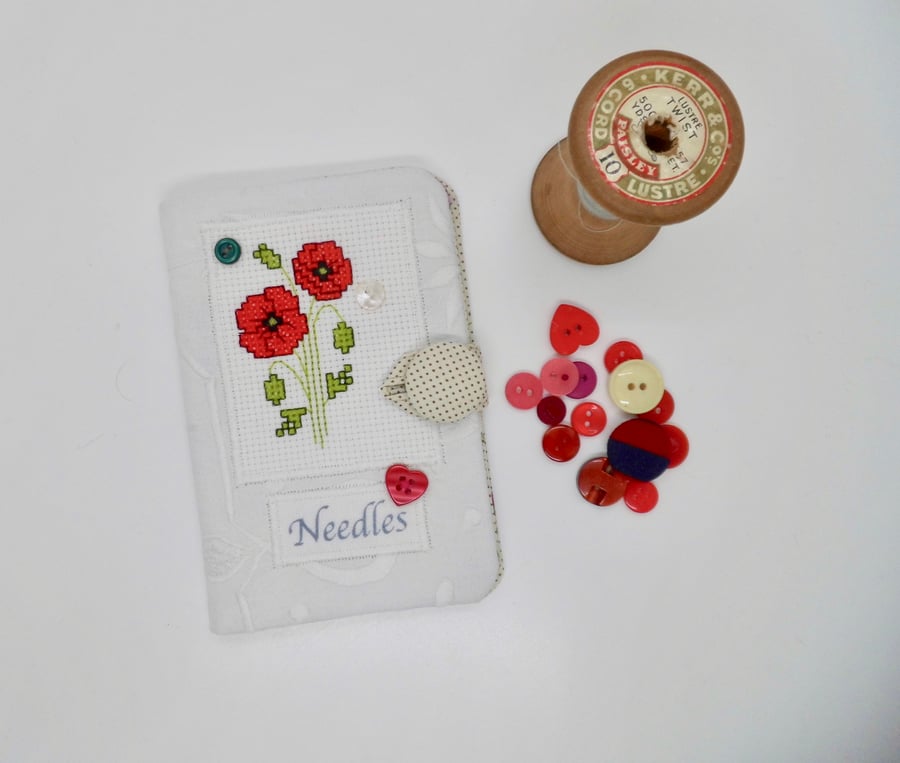 SOLD Sewing needle case white with poppy cross stitch.
