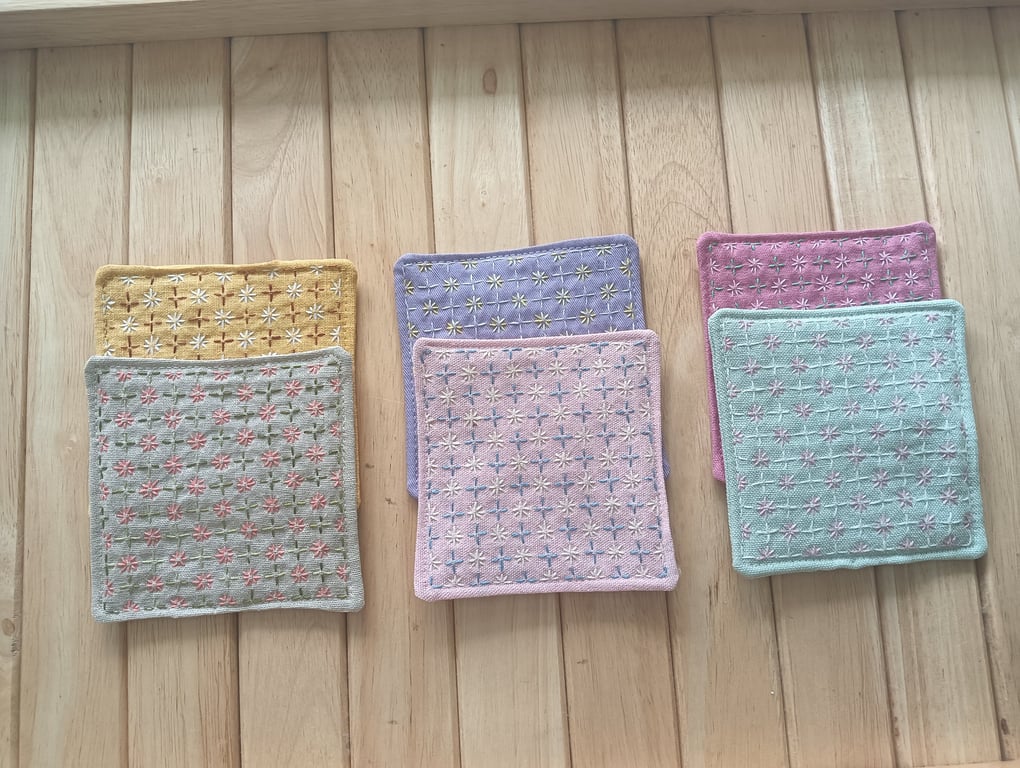 Set of six handmade coasters with sashiko embroidered patterns.