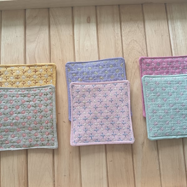 Set of six handmade coasters with sashiko embroidered patterns.