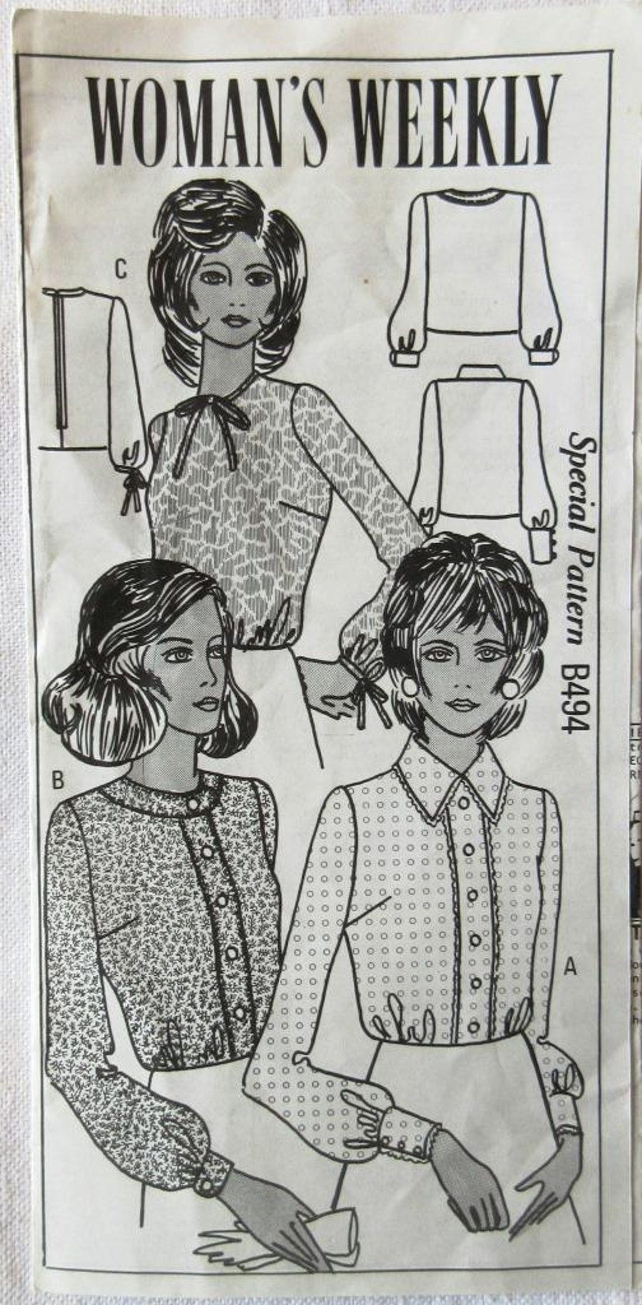 A vintage sewing pattern for a woman's blouse in 3 styles and size 18 