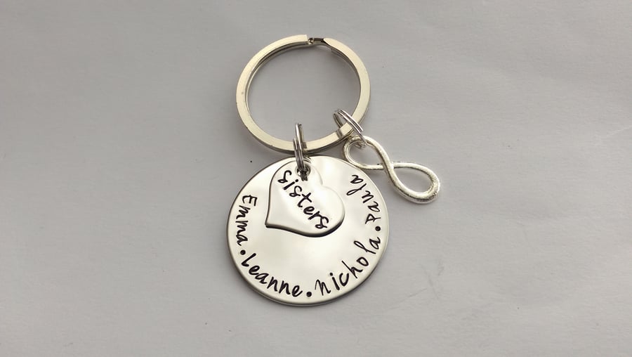 Hand stamped personalised sisters name keyring with inifinity charm