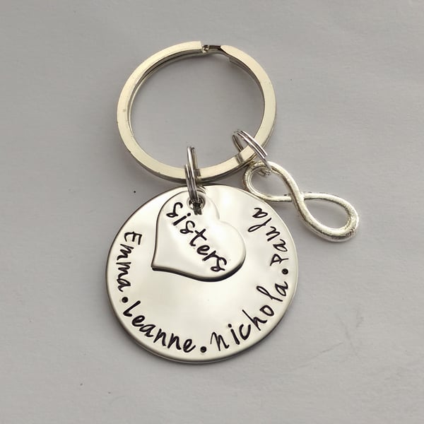 Hand stamped personalised sisters name keyring with inifinity charm