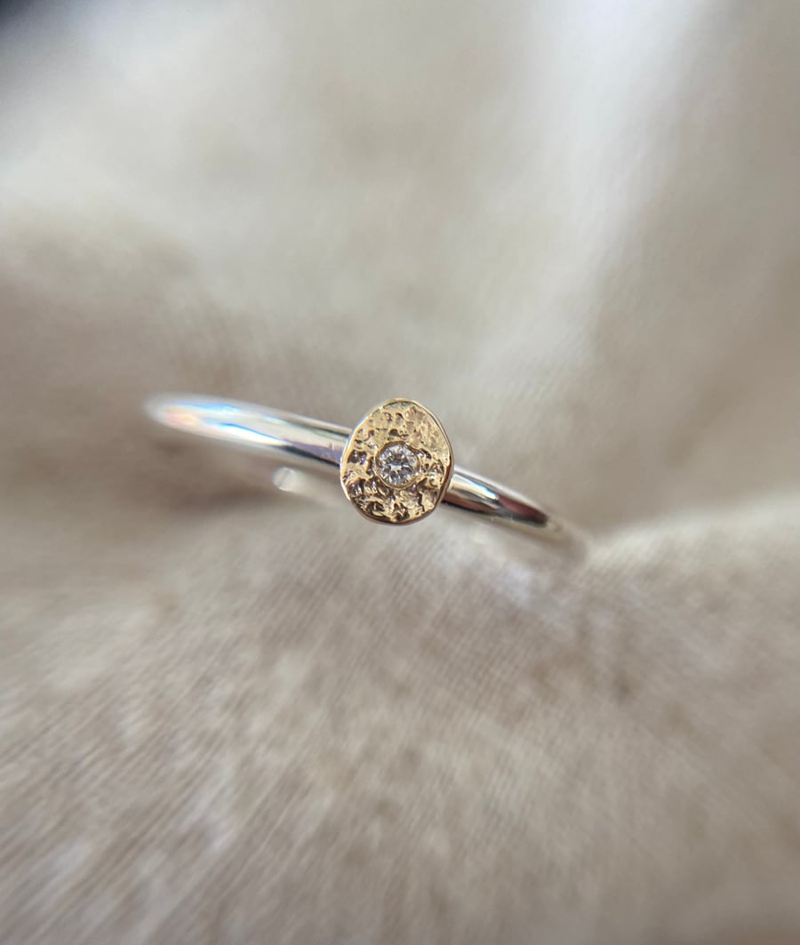 Genuine diamond in solid molten gold on a Sterling silver band 