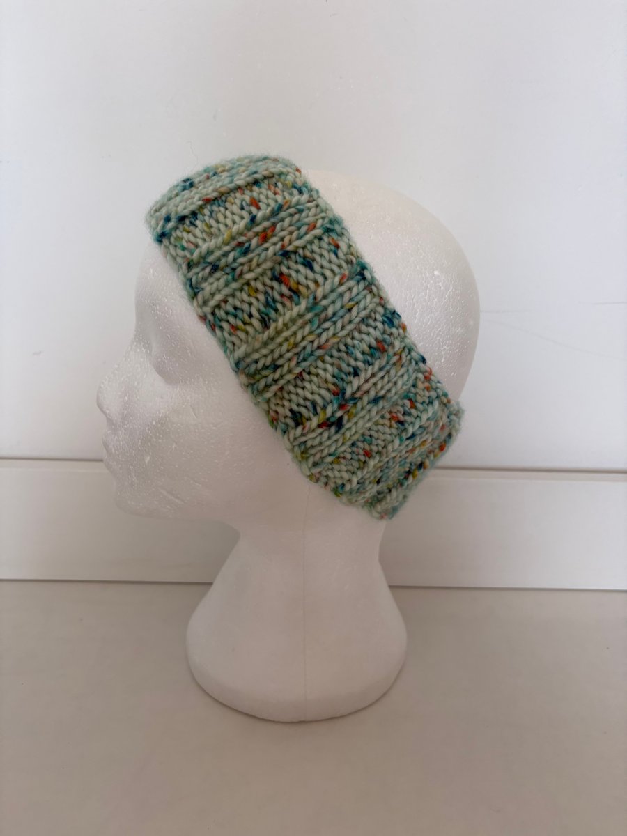 Mint green fleck knitted headband. 