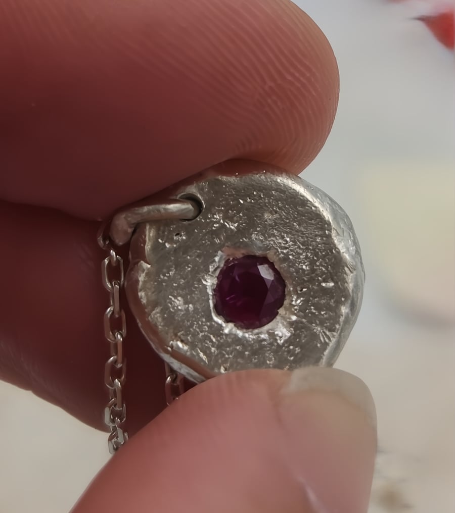 Molten Silver Pendant with Radiant Ruby Accent