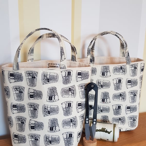 Reusable fabric gift bag for a sewing enthusiast with sewing tools