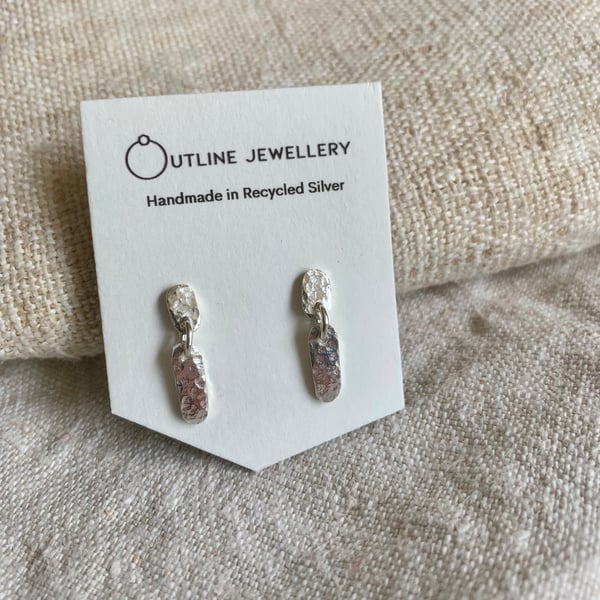 Small hammered dash stud drop earrings in recycled silver.