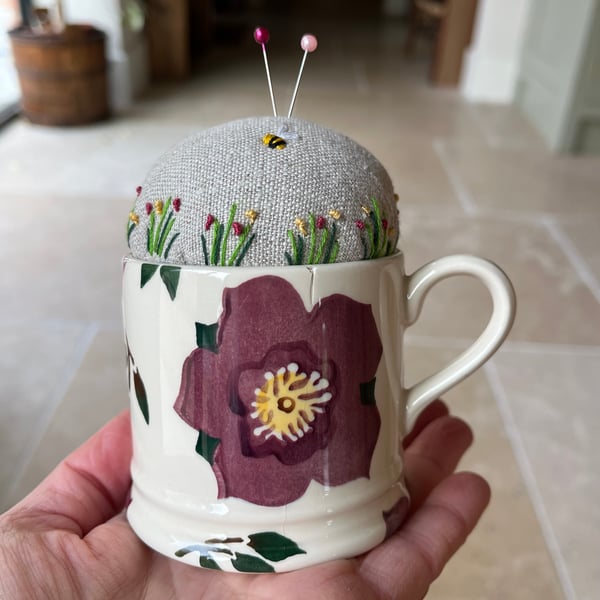 Repurposed hellebore cup embroidered pin cushion