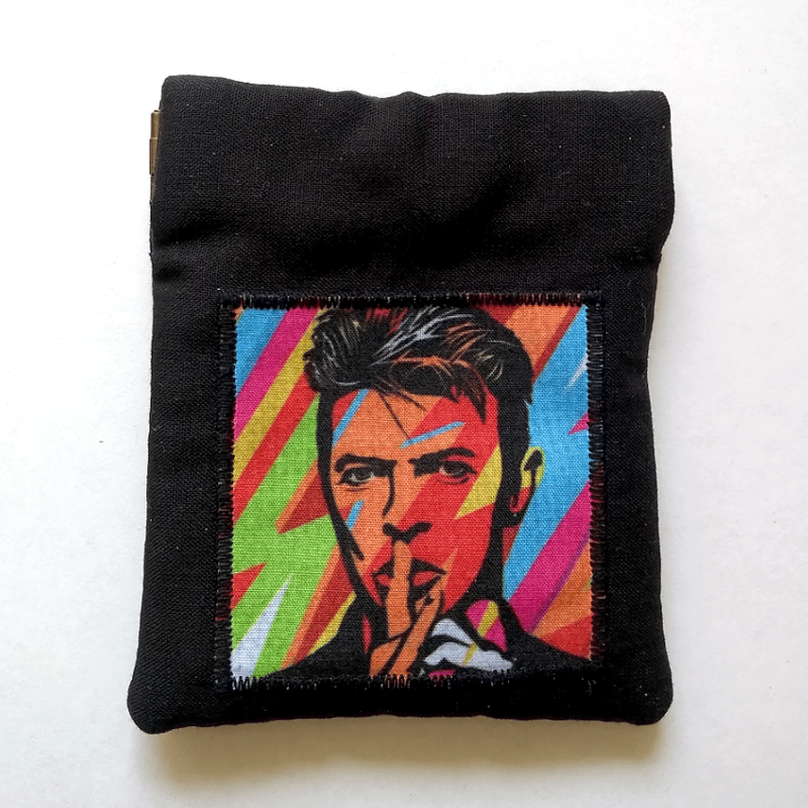 Earbud pouch or coin purse featuring musical legend