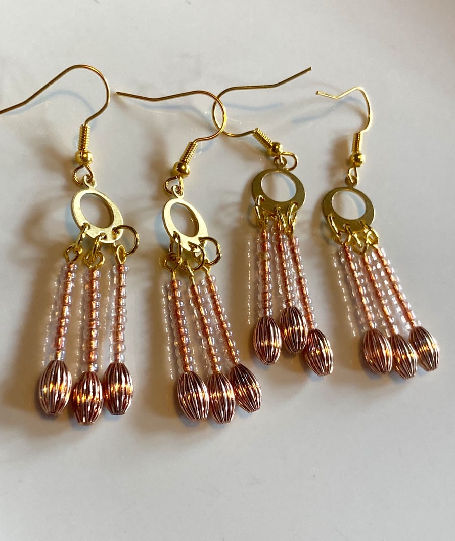 Rose Gold dangle drop beaded earrings.