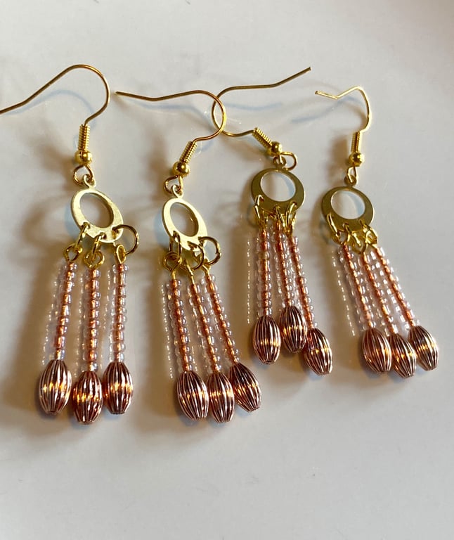 Rose Gold dangle drop beaded earrings.