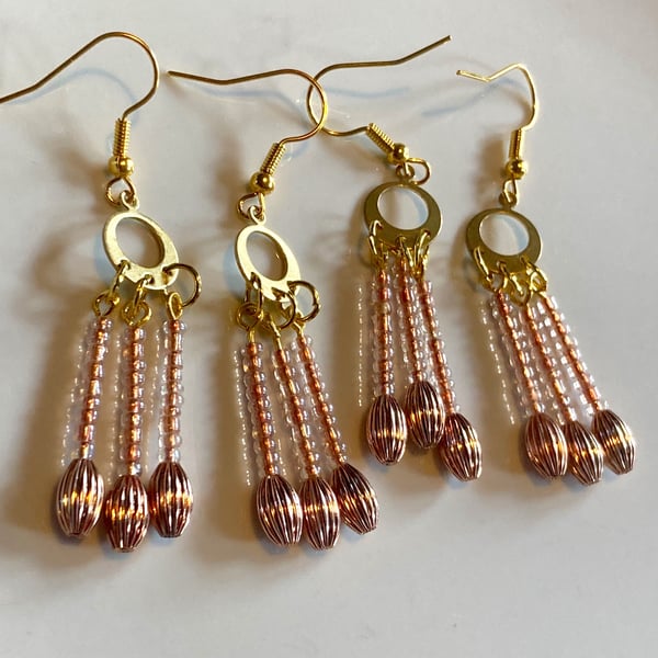 Rose Gold dangle drop beaded earrings.