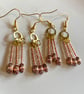 Rose Gold dangle drop beaded earrings.