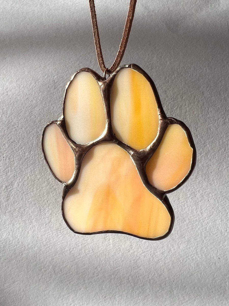 Pale orange stained glass paw decoration - dog paw decoration apricot colour