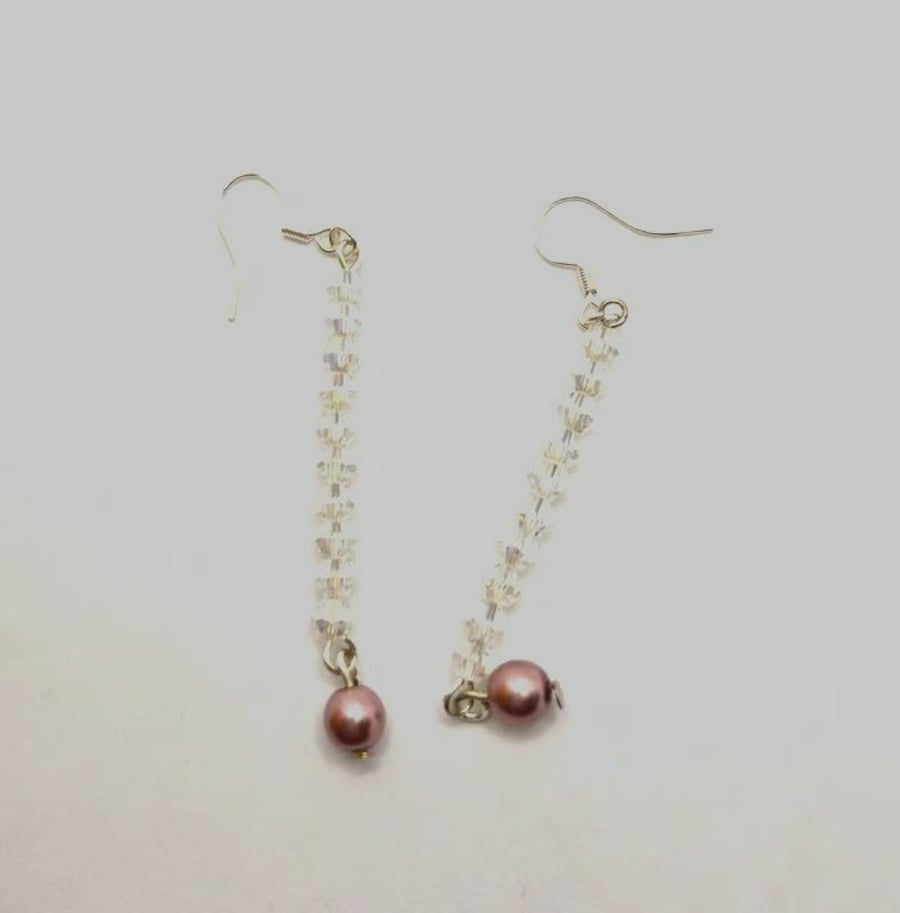 Handmade dangle earrings made with Swarovski crystals and faux pearls