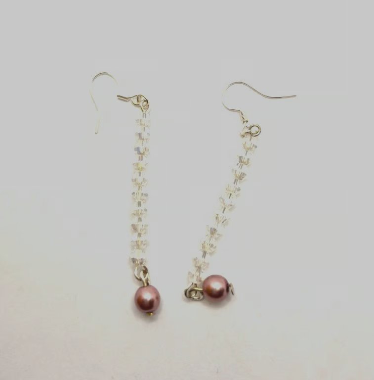 Handmade dangle earrings made with Swarovski crystals and faux pearls