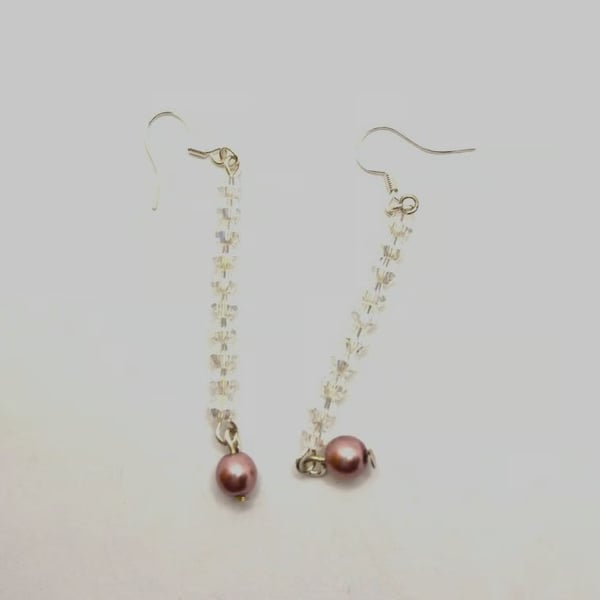 Handmade dangle earrings made with Swarovski crystals and faux pearls