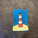 Lighthouse patch with blue background 