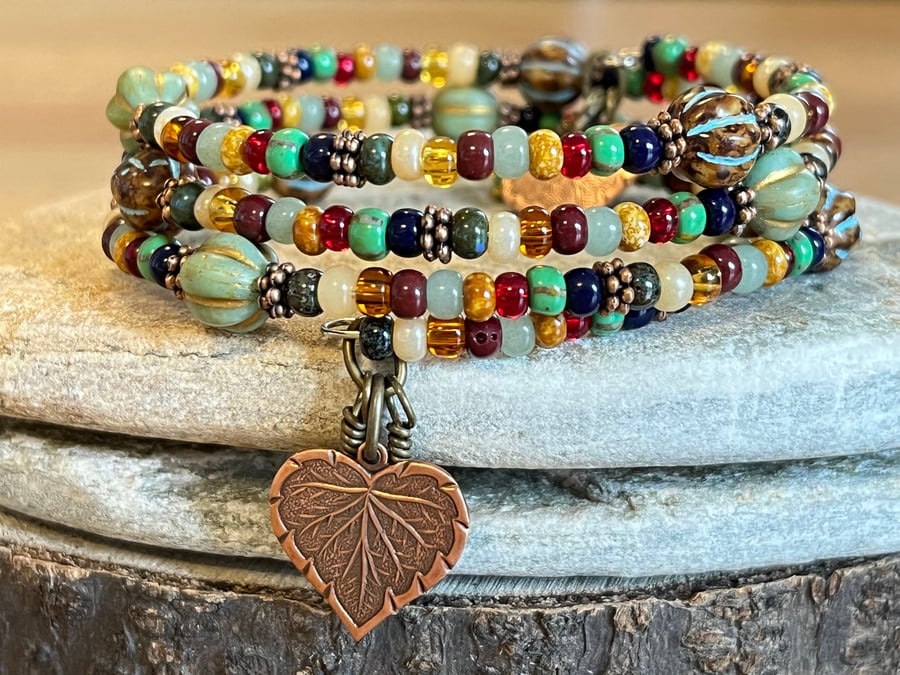 Colourful and rustic boho beaded memory wire wrap bracelet with floral charms