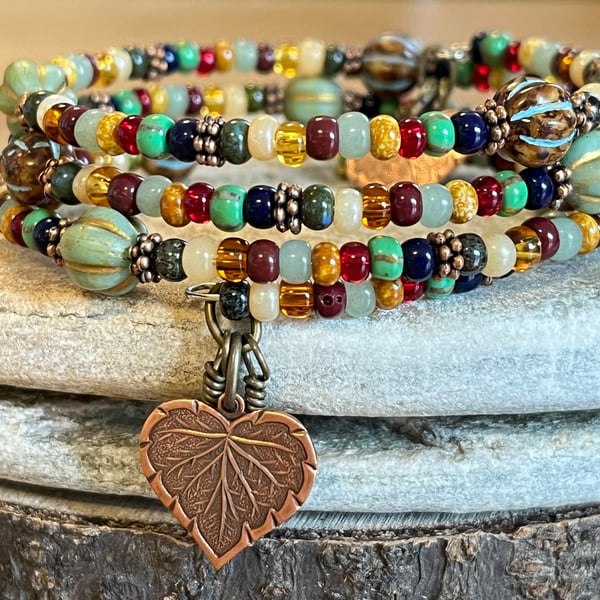 Colourful and rustic boho beaded memory wire wrap bracelet with floral charms