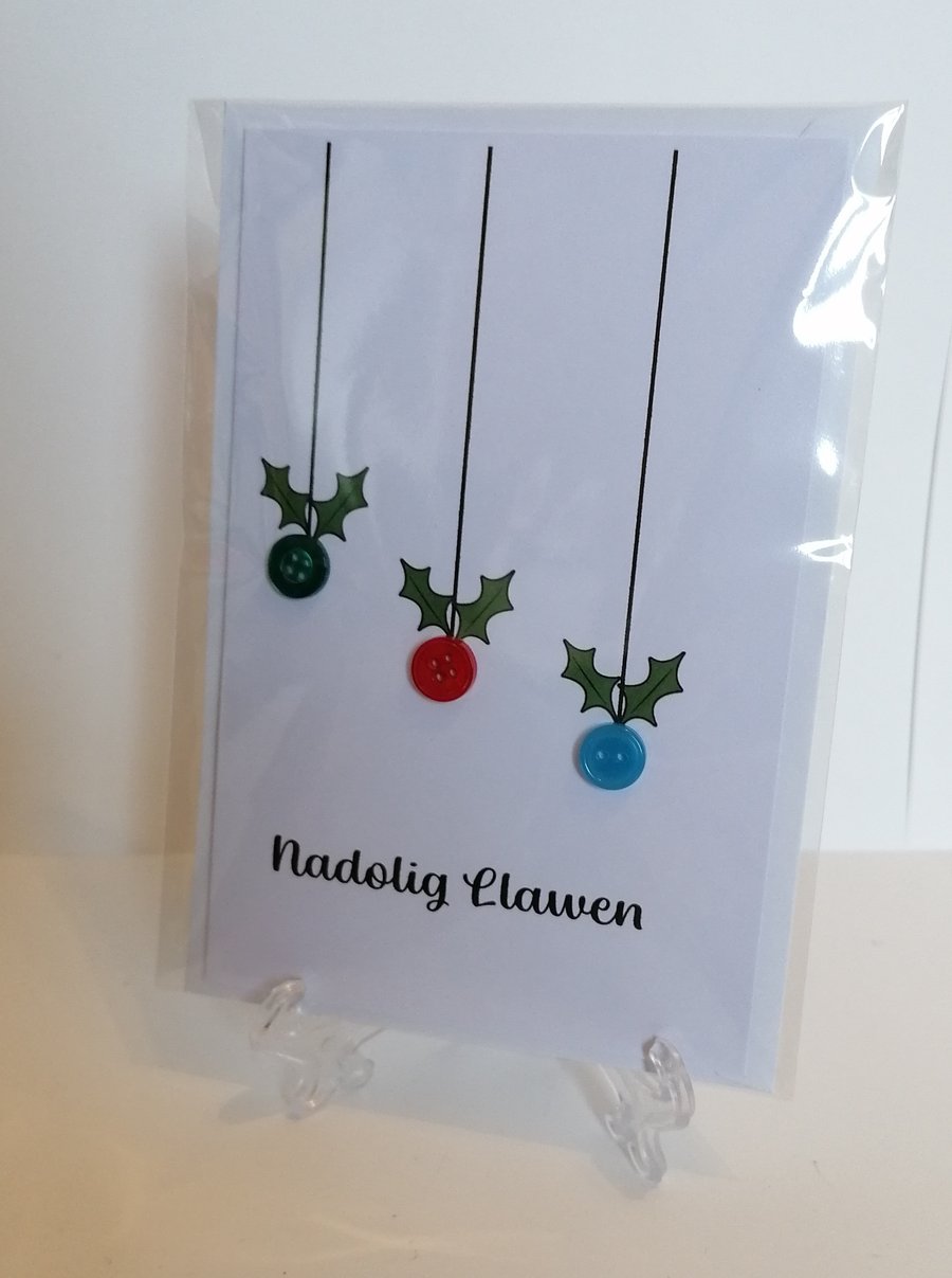 Nadolig Llawen (Merry Christmas) card with hanging baubles. 