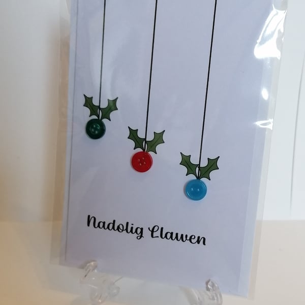 Nadolig Llawen (Merry Christmas) card with hanging baubles. 
