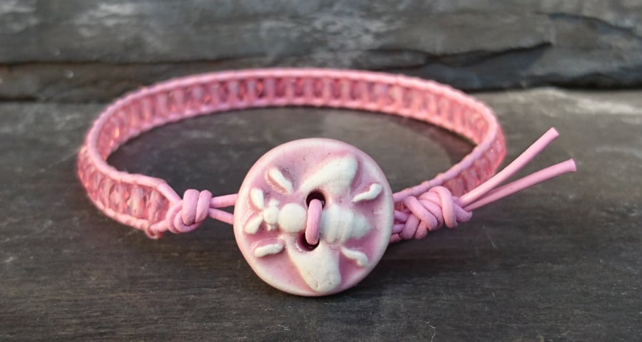 Pastel pink leather and glass bead bracelet with ceramic bee button