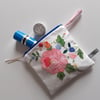 Pink flower purse make up or storage bag upcycled in vintage appliqued fabric   